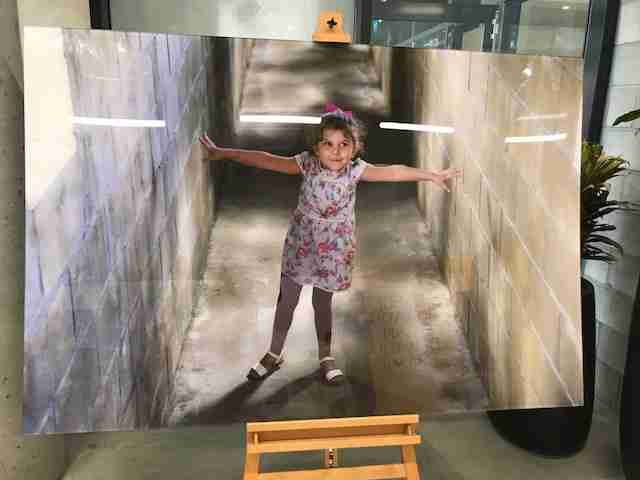 Photo of a photo of a young girl.