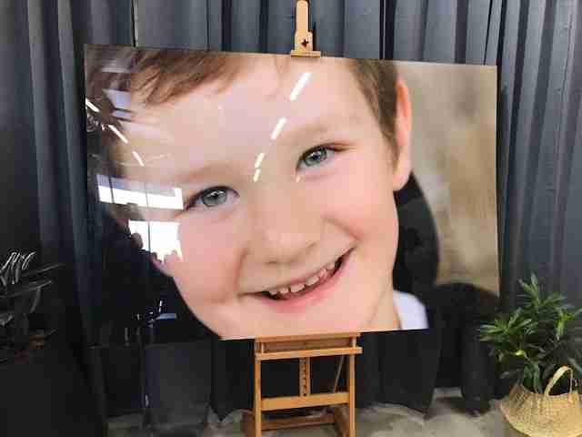 Photo of a photo of a young boy.