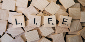 Scrabble tiles spelling "life"