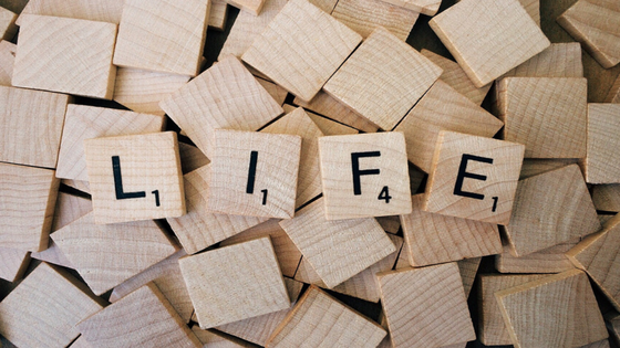 Scrabble tiles spelling "life"