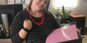 Sophie, our admin assistant showing her Fitbit.