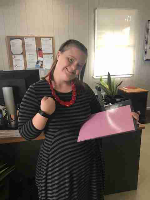 Sophie, our admin assistant showing her Fitbit.