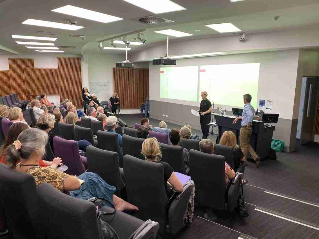 Rear view of people sitting in a lecture theatre