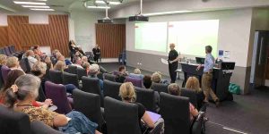 Rear view of people sitting in a lecture theatre