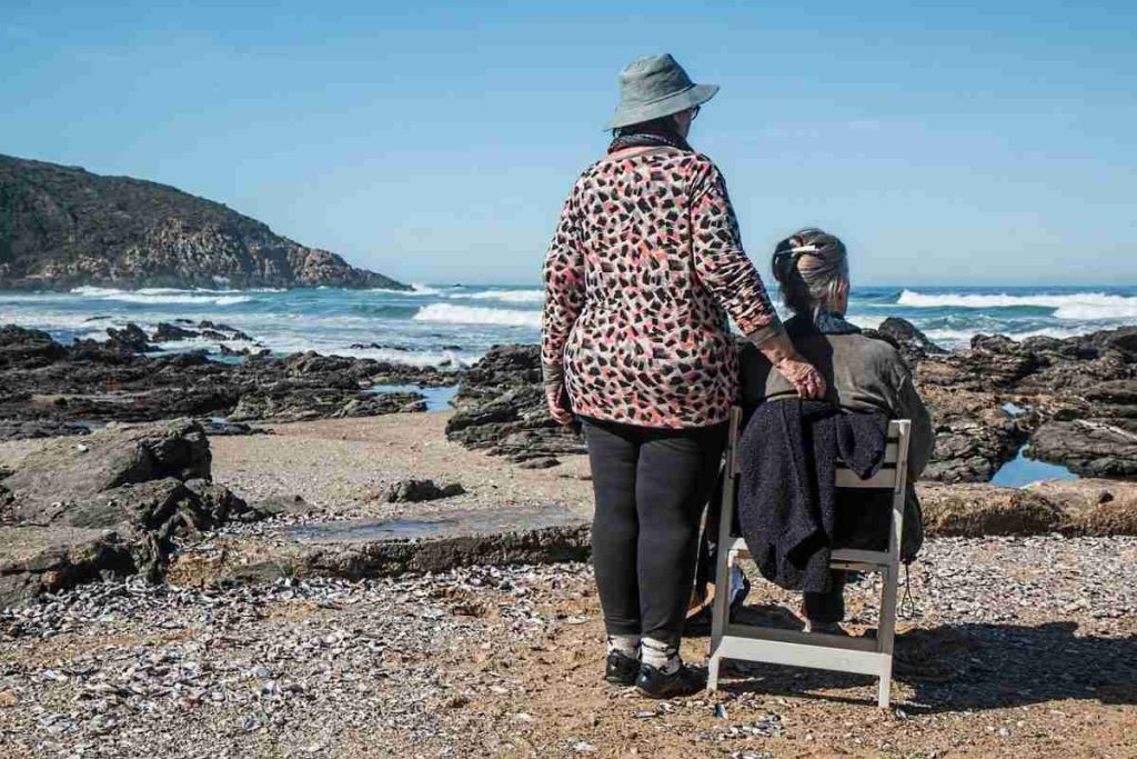 women looking at the ocean
