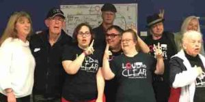 A group of people doing the peace sign
