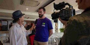 Man being interviewed and recorded