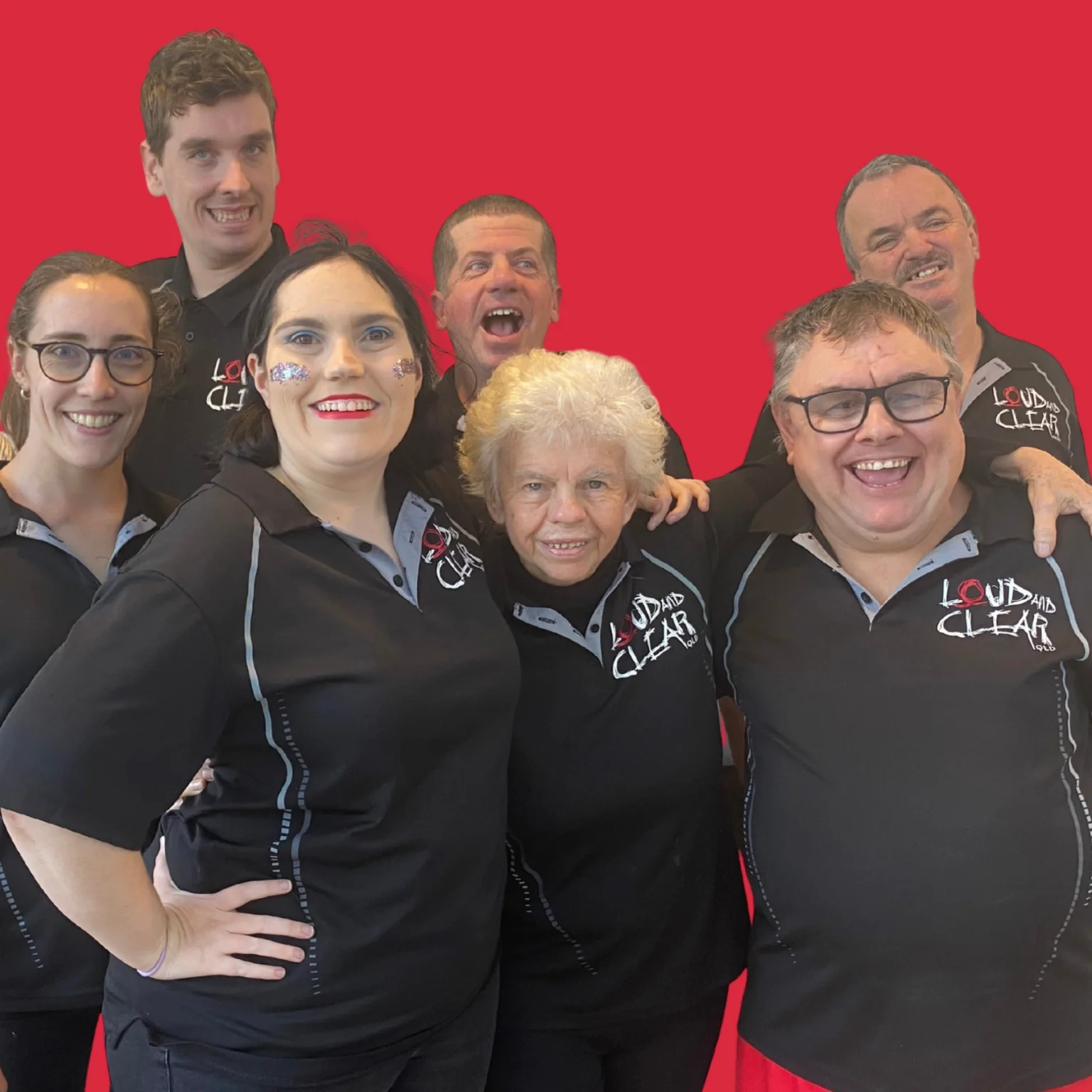 A group of 7 people smiling