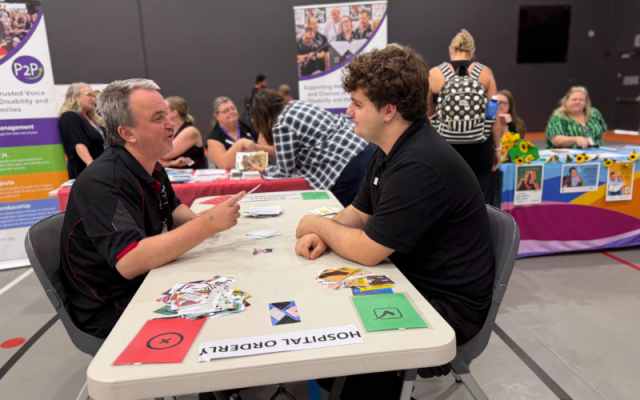 Chris and Josh sitting at an activity table